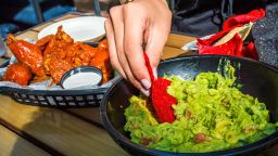 Super Bowl food cost chicken wings guacamole RESTRICTED