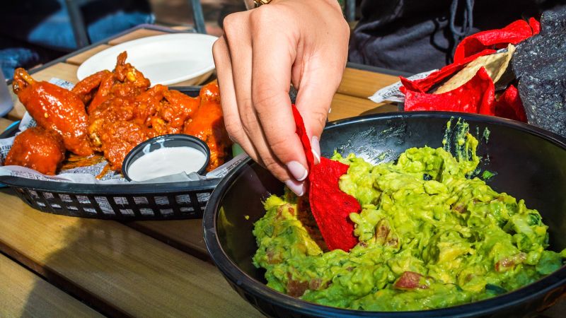 NextImg:Super Bowl party people rejoice: Chicken wings and guacamole will cost less this year | CNN Business