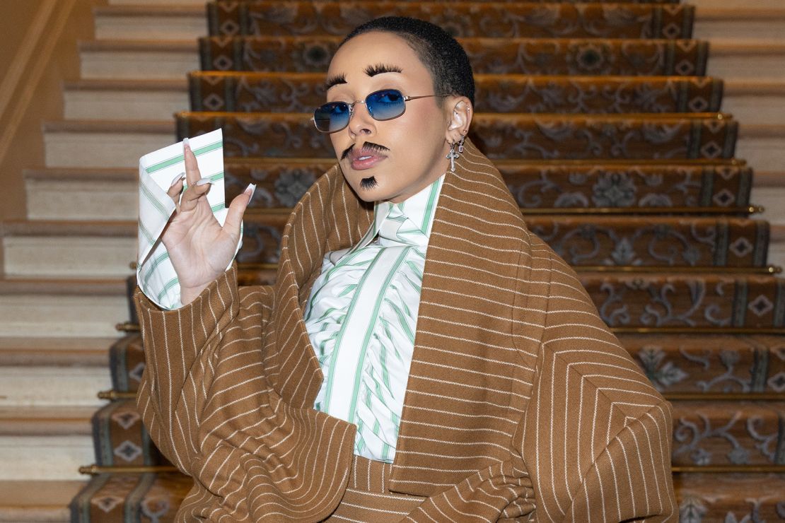 Doja Cat's oversized suit and eyelash mustache caused a stir at the Viktor & Rolf runway.