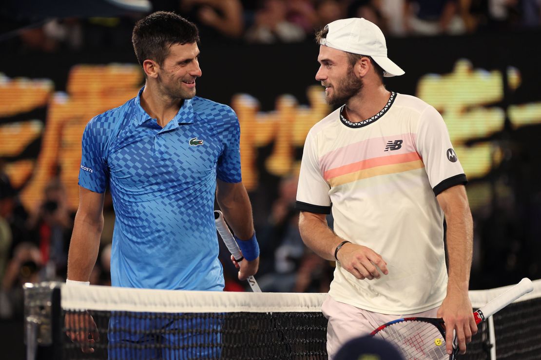 Djokovic and Paul chat at the net during their semifinal at the Australian Open.