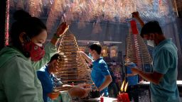 People pray over incense at Thien Hau Pagoda for the Tet New Year on January 24, 2023 in HO CHI MINH.