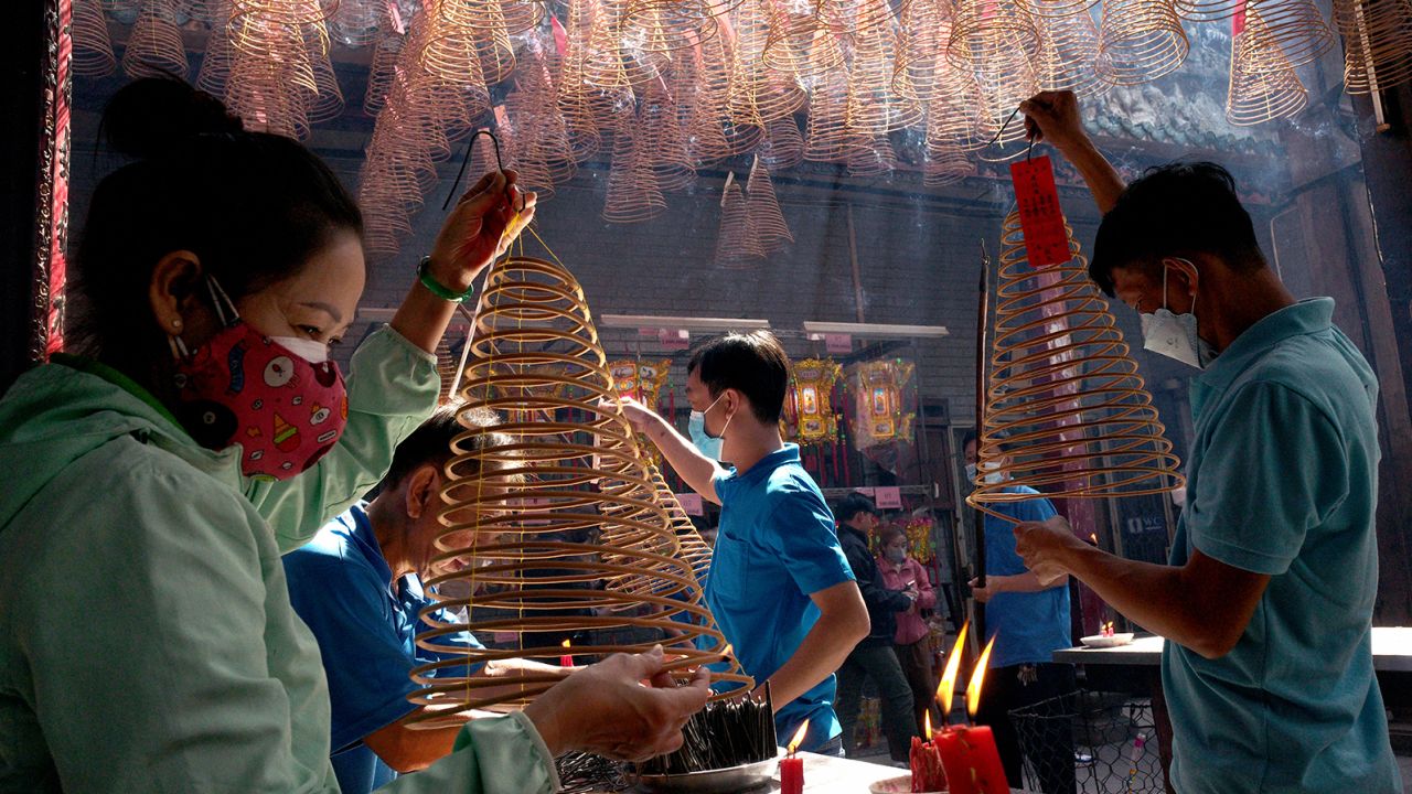 People pray over incense at Thien Hau Pagoda for the Tet Lunar New Year on January 24 in Ho Chi Minh City, Vietnam.