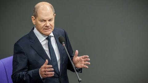 Chancellor Olaf Scholz speaks in Germany's Bundestag after announcing that his government would deliver Leopard battle tanks to Ukraine. 