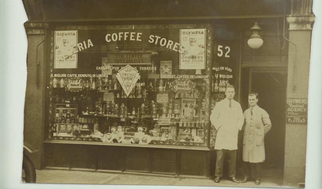 A n image from the 1930s of Algerian Coffee Stores, on Old Compton Street. The shop was founded by an Algerian national now remembered only as Mr. Hassan. The shop was subsequently bought by a Belgian, who sold it to an Englishman in 1940s, whose descendants run the shop today.