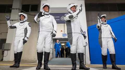 Watkins (from left) and crewmates Bob Hines, Kjell Lindgren and Samantha Cristoforetti walk out of the crew quarters at Kennedy Space Center before their April 27 launch to the space station.
