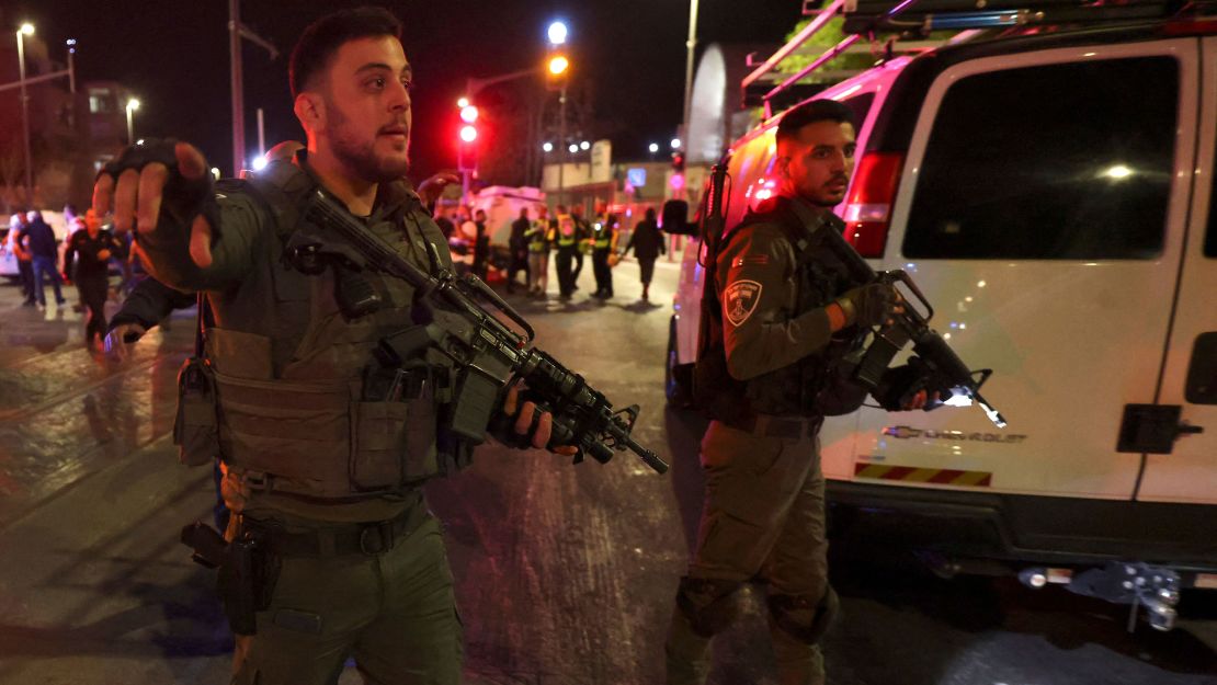 Israeli security forces  are seen at the site of Friday's attack in Jerusalem.