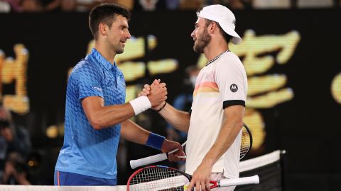 Djokovic and Paul kiss at the net after their Australian Open semi-final. 