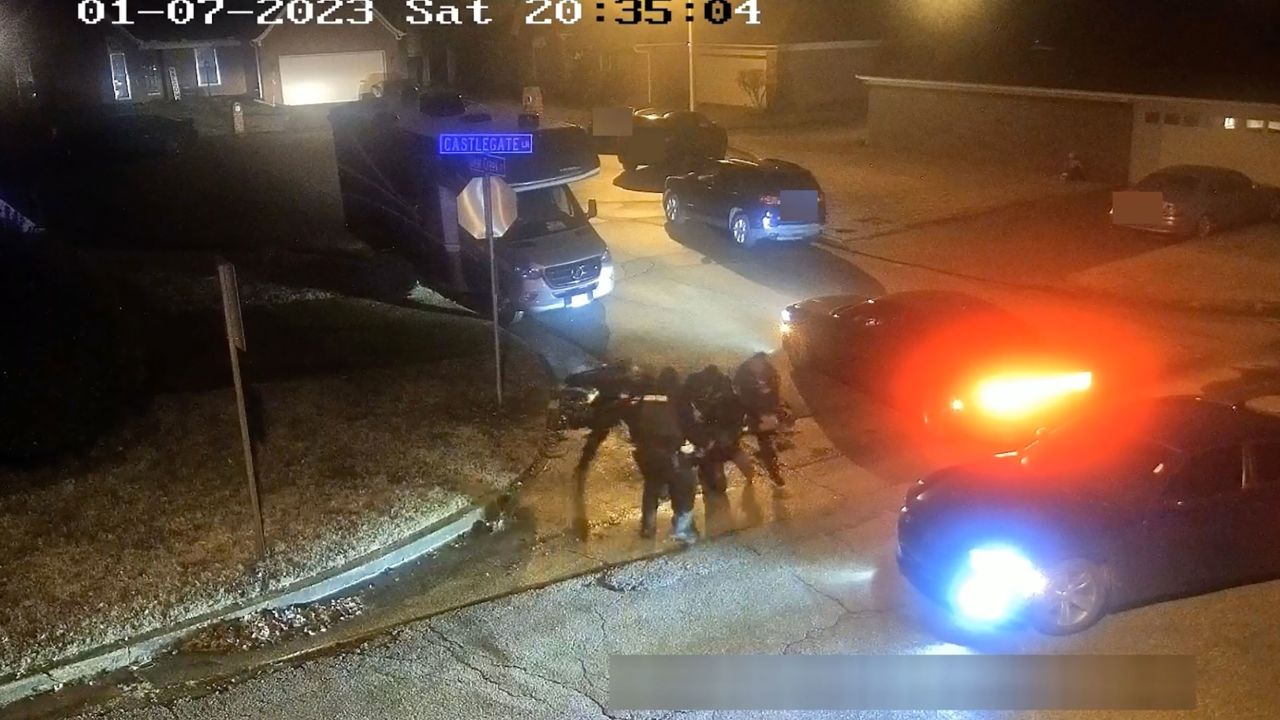In this still from video, officers beat Tyre Nichols on a street corner.