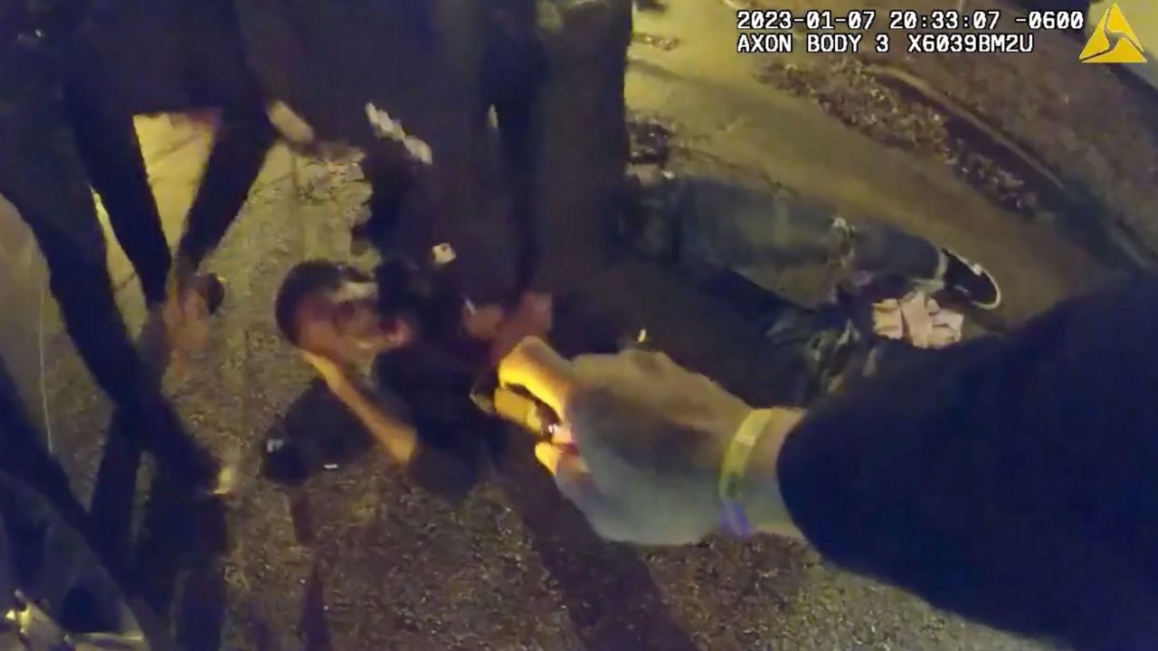In this still from video released by the City of Memphis, officers appear to spray Tyre Nichols with pepper spray.