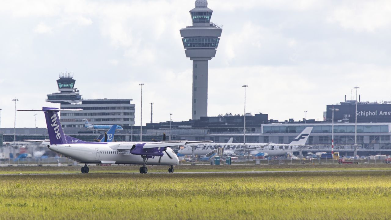 A Flybe Bombardier DHC-8-400 turboprop aircraft lands at Amsterdam Schiphol Airport after leaving from London Heathrow on June 1, 2022.