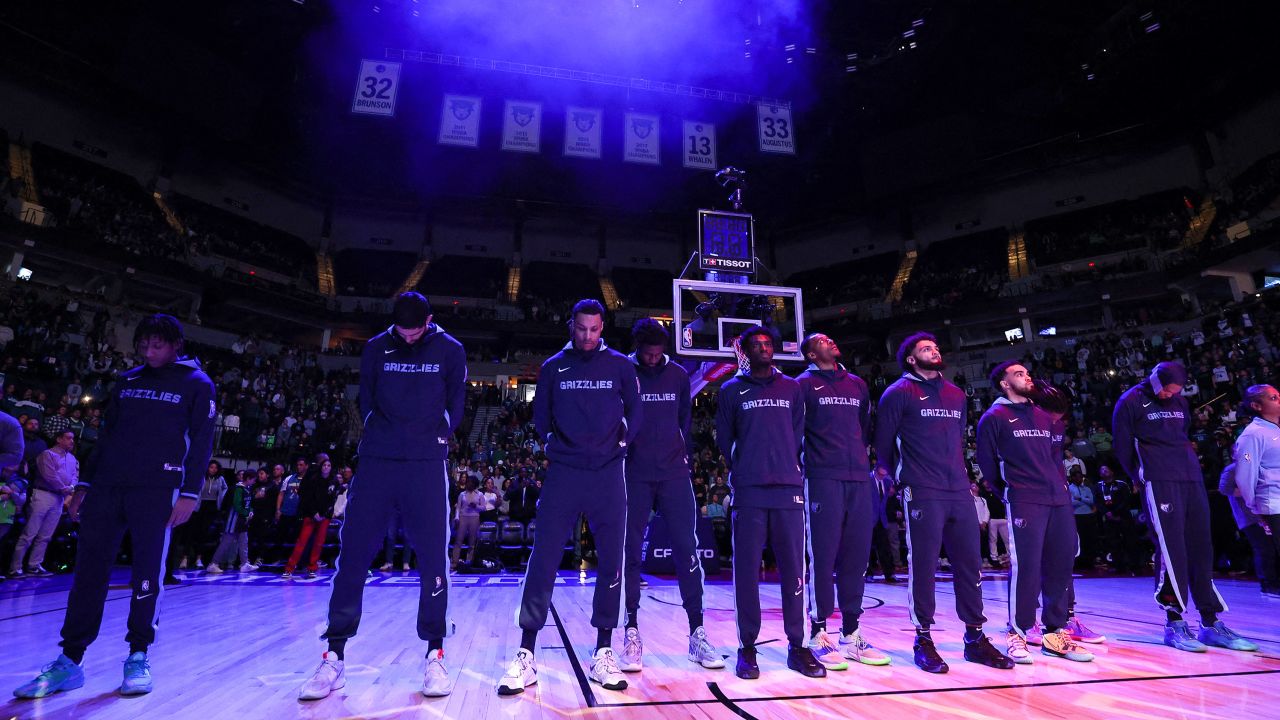Memphis Grizzlies stand for a moment of silence for Tyre Nichols before the game against the Minnesota Timberwolves on Friday. 