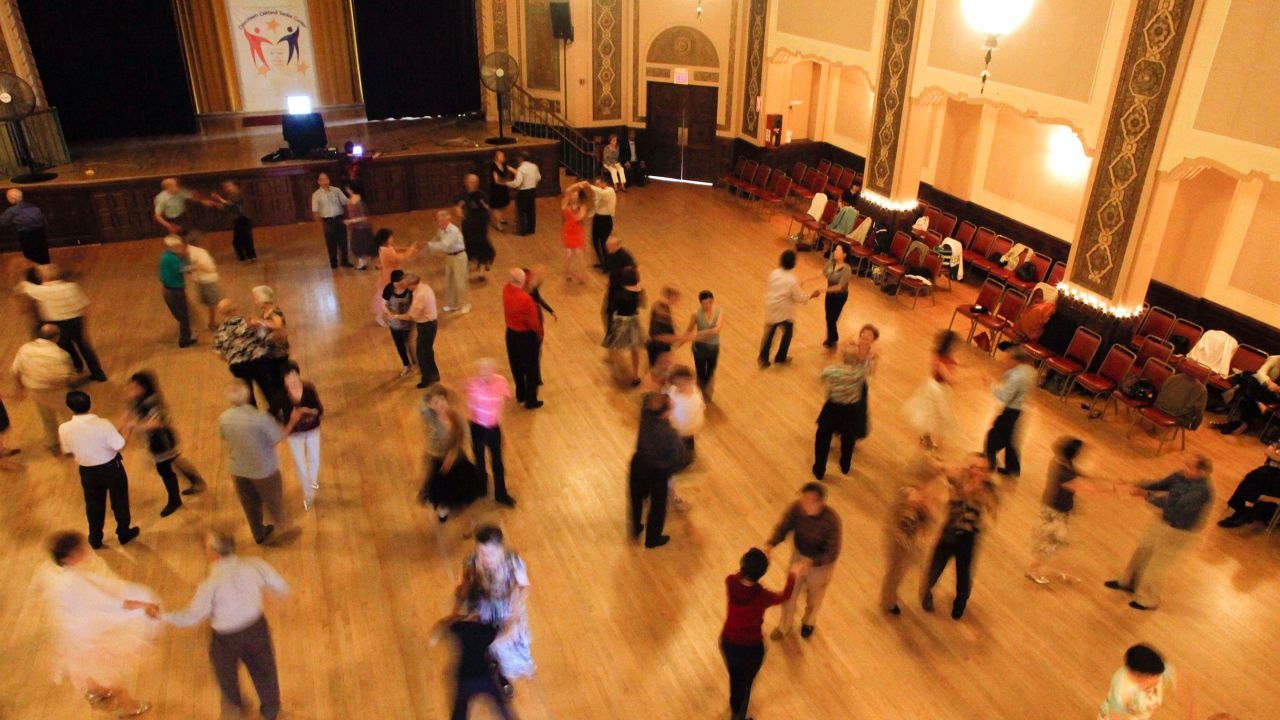 Ballroom dancers fill the floor at a senior center in Oakland, California.