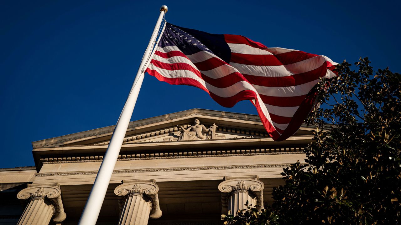 An American flag is seen outside the Department of Justice building in Washington, DC, on  December 15, 2020.