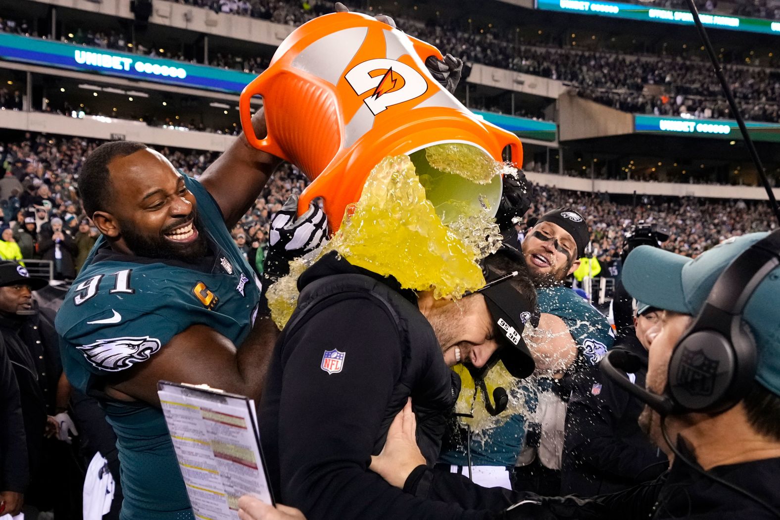 Philadelphia Eagles head coach Nick Sirianni is doused by defensive tackle Fletcher Cox, left, and teammates after the Eagles won the NFC Championship on Sunday, January 29. Philadelphia will play the Kansas City Chiefs in the <a href="index.php?page=&url=https%3A%2F%2Fwww.cnn.com%2F2023%2F01%2F29%2Fus%2Fnfl-conference-championships-chiefs-bengals-eagles-49ers%2Findex.html" target="_blank">Super Bowl</a>.