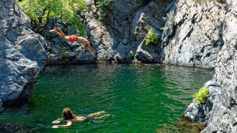 The island is known for its 'vathres,' or waterfall-fed pools.