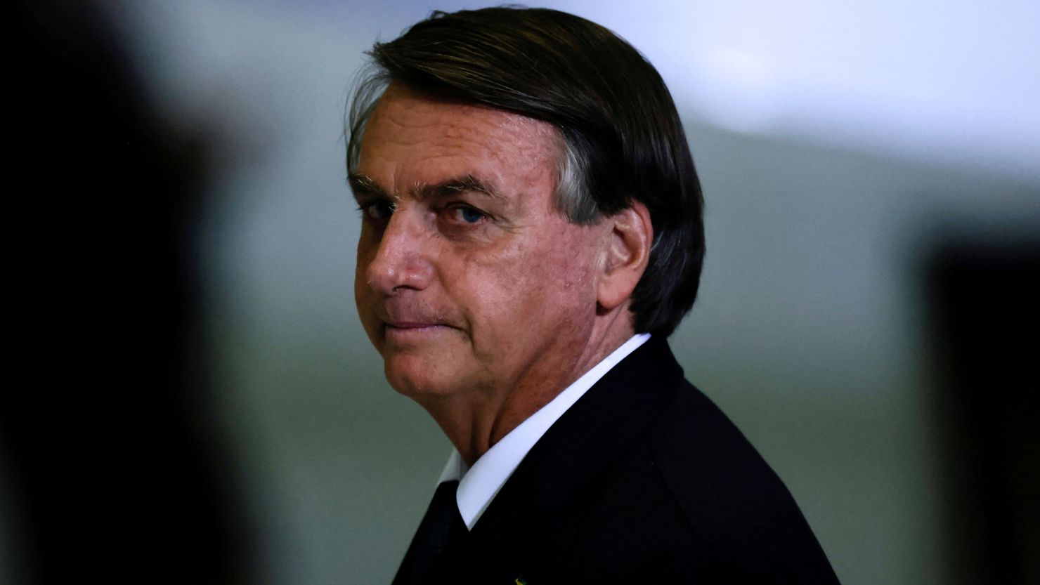 Bolsonaro looks on after a ceremony about the National Policy for Education at the Planalto Palace in Brasilia, Brazil June 20, 2022. 