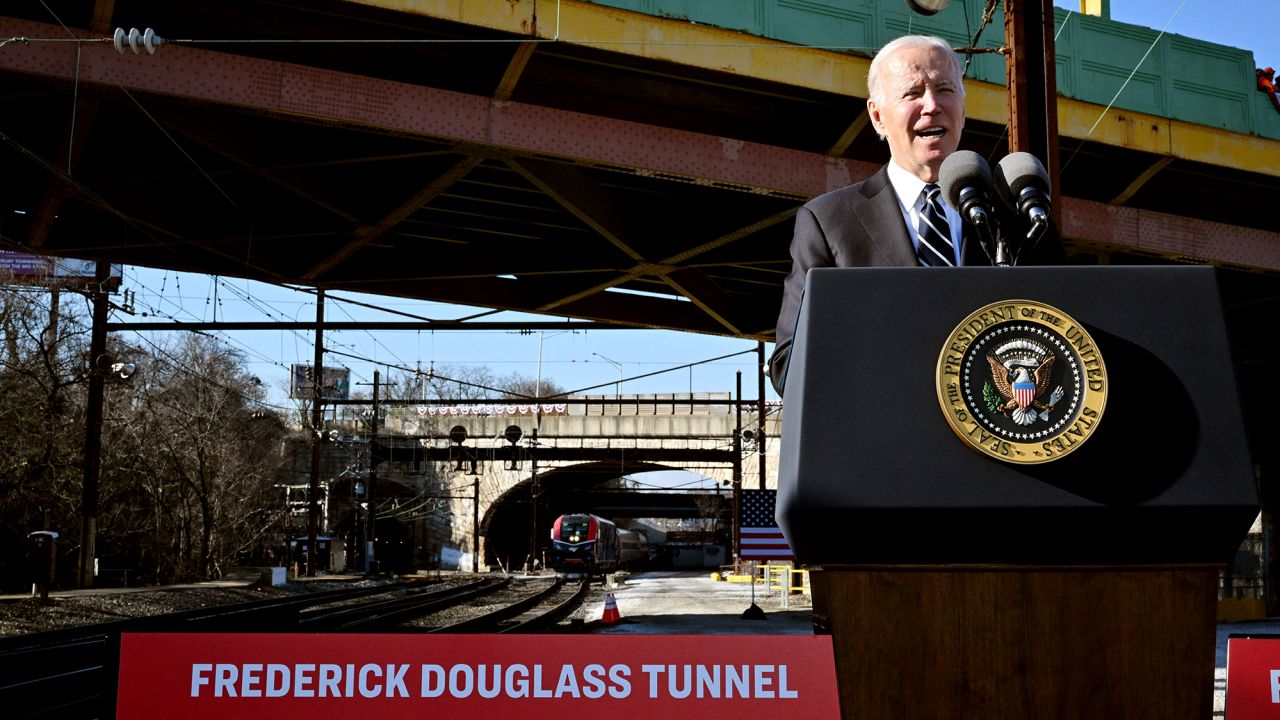 US President Joe Biden delivers remarks on how the Bipartisan Infrastructure Law will provide funding to replace the 150-year-old Baltimore and Potomac Tunnel, at the Baltimore and Potomac Tunnel North Portal in Baltimore, Maryland, on January 30.