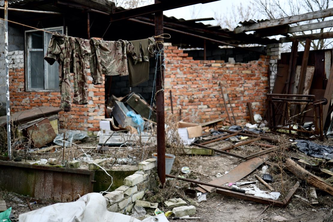 Camoflage is seen hanging on a line in a ruined building in the village of Zarichne, eastern Ukraine.