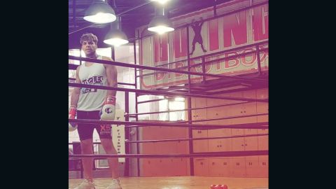 Ashkan Morovati trains in a boxing ring.
