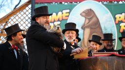 PUNXSUTAWNEY, PA, USA - FEBRUARY 2: Punxsutawney Phil saw his shadow on Tuesday  morning 6 more weeks of winter during Groundhog Day celebration at the Gobbler's Knob in Punxsutawney, Pennsylvania, United States on February 2, 2022. Punxsutawney Groundhog Club established in 1887 as members believe that groundhogs predict the weather.