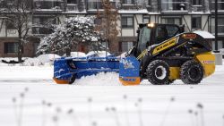 A snow plow cleans snow Sunday, Jan. 29, 2023, in Buffalo Grove, Ill. (AP Photo/Nam Y. Huh)