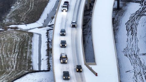 An icy mix covers Highway 114 on Monday in Roanoke, Texas.