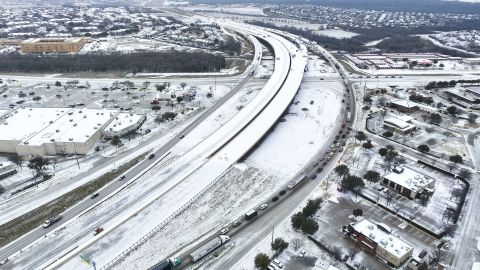An icy mix covers Highway 114 on Monday in Roanoke, Texas.