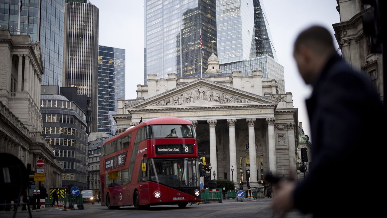 A person crosses the street outside the Bank of England in London on Jan. 23, 2023.