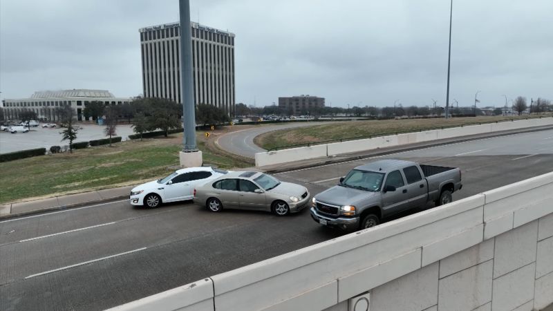 NextImg:See cars slip and slide on icy bridge in Texas | CNN