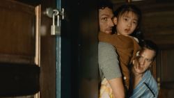 (from left) Ben Aldridge, Kristen Cui, and Jonathan Groff in KNOCK AT THE CABIN, directed and co-written by M. Night Shyamalan.
