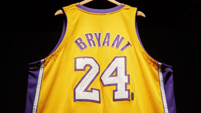 Kobe Bryant looks up in a white Laker home jersey.JPG