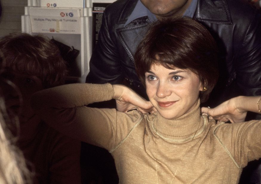Williams is photographed at an autographing party at a Sam Goody store in New York City in 1976.