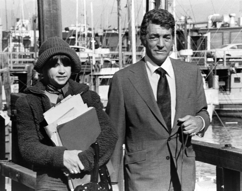 Williams is pictured with Dean Martin on set of the movie "Mr. Ricco," in 1975. 