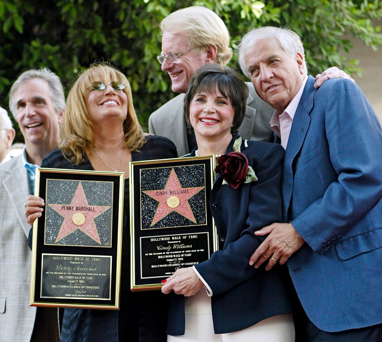 Winkler, Marshall, Ed Begley, Williams and Garry Marshall pose after Penny Marshall and Williams received their stars on the Hollywood Walk of Fame in 2004.