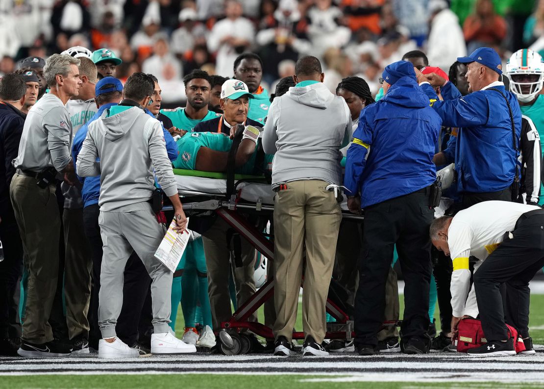 Tua Tagovailoa of the Miami Dolphins is carted off on a stretcher after an injury in a game against the Cincinnati Bengals on September 29, 2022.