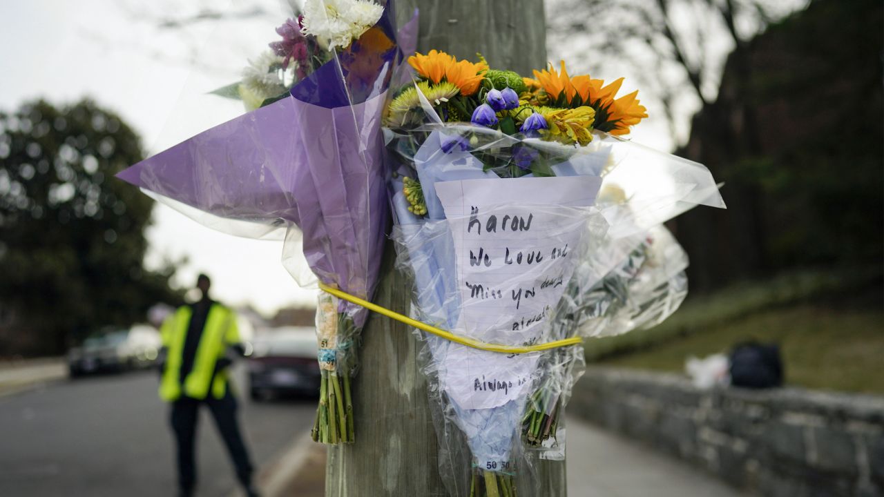 Flowers are secured to a pole as a memorial to Karon Blake, 13,  in Washington, DC. 