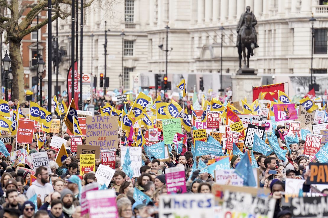 Striking workers march in London on February 1, 2023 over pay, working conditions and a controversial government bill that will curb the right to strike.