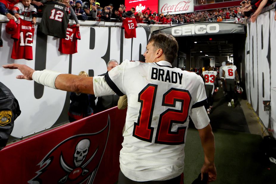 Brady walks off the field after a playoff loss to the Dallas Cowboys in an NFC Wild Card game in January 2023. The Cowboys won 31-14.