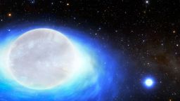This is an artist's impression of the first confirmed detection of a star system that will one day form a kilonova — the ultra-powerful, gold-producing explosion created by merging neutron stars. These systems are so phenomenally rare that only about 10 such systems are thought to exist in the entire Milky Way.