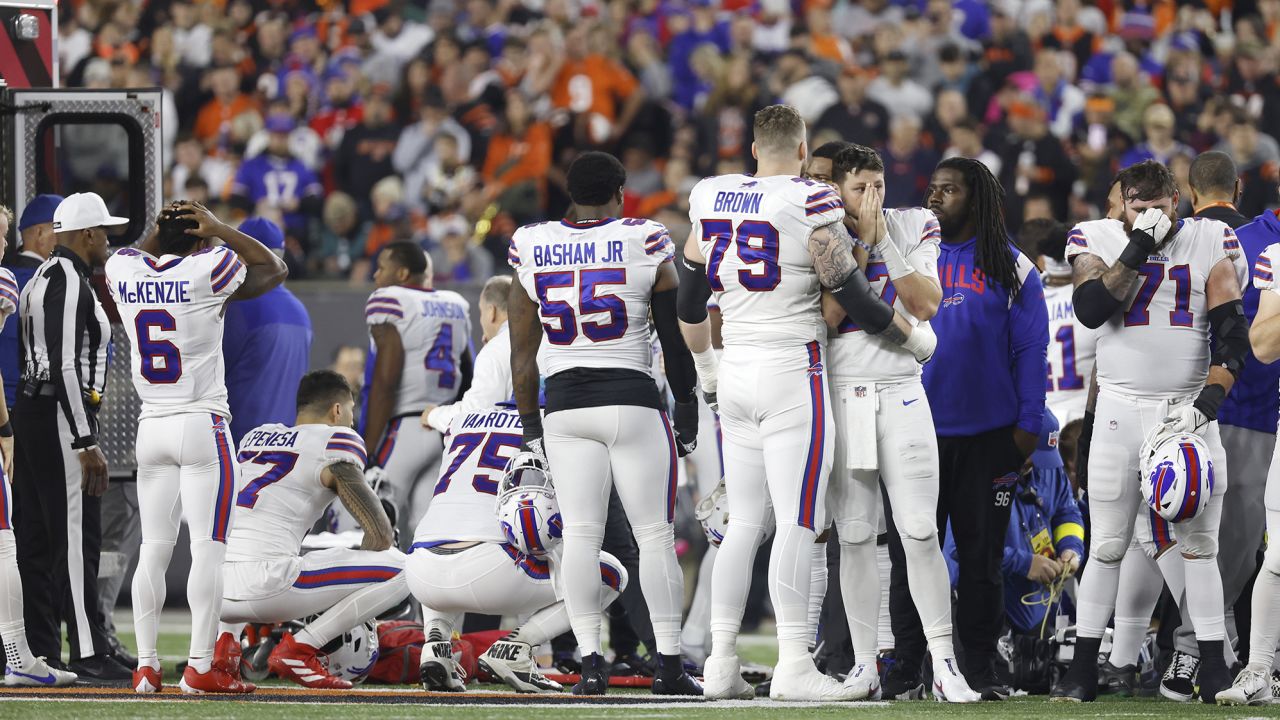 Buffalo Bills players react after teammate Damar Hamlin is injured during their game against the Cincinnati Bengals on January 2 in Cincinnati.