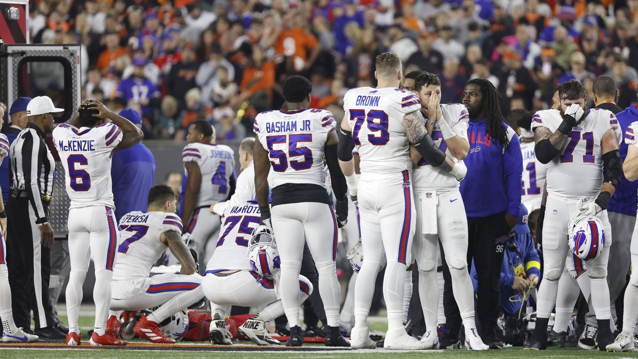 Buffalo Bills players react after Hamlin suffered a cardiac arrest on the field during a game against the Bengals.