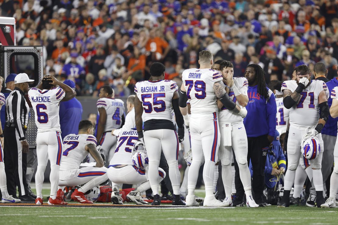 Buffalo Bills players react after Hamlin suffered a cardiac arrest on the field during a game against the Bengals.