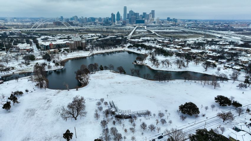 An icy mix covers Lake Cliff Park on Tuesday, Jan. 31, 2023, in Dallas. Dallas and other parts of North Texas are under a winter storm warning that has been extended through Thursday. (Smiley N. Pool/The Dallas Morning News via AP)