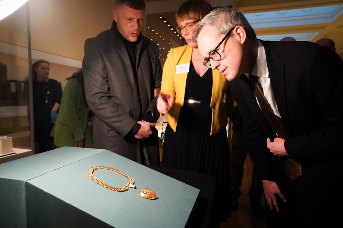 Charlie Clarke (left) looks at the pendant on display at the British Museum in London.