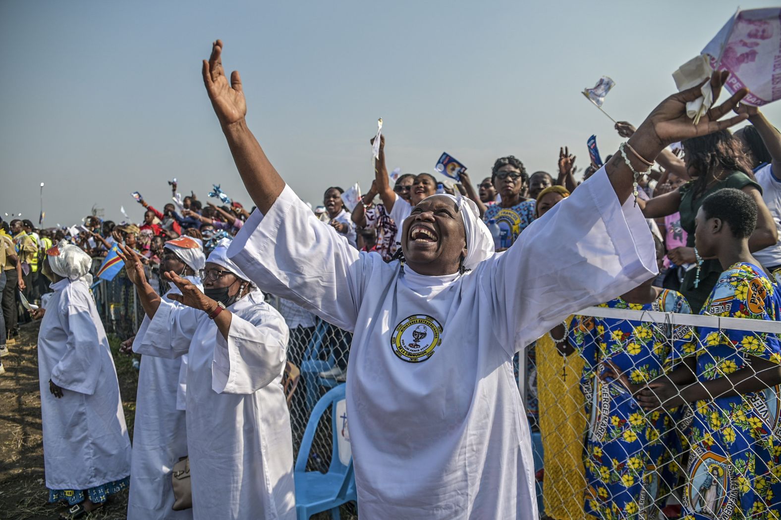 Worshipers greet Pope Francis as he arrives at N'Dolo Airport.