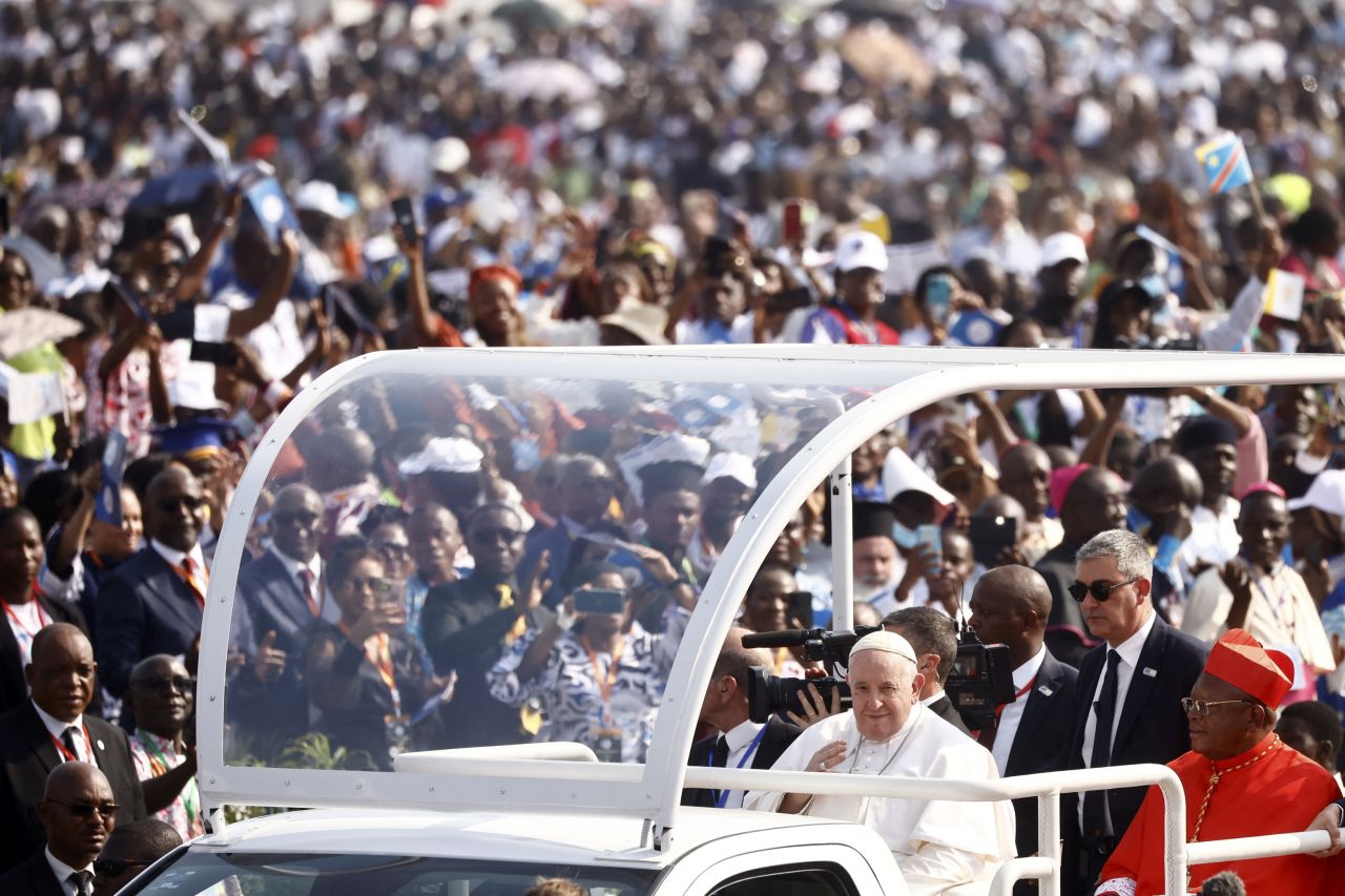 Pope Francis is seen amid a crowd at N'Dolo Airport on February 1.