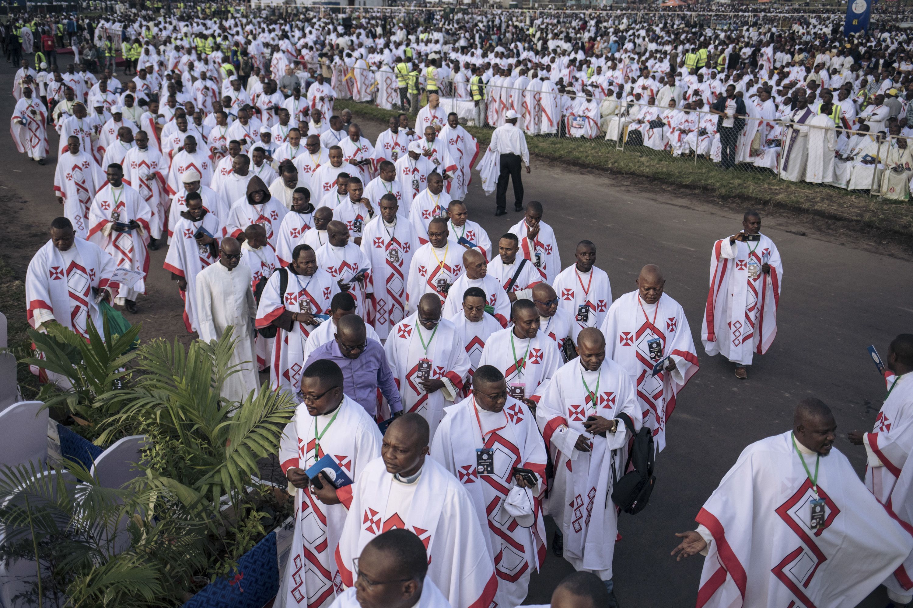 Attendees arrive ahead of Pope Francis' Mass at N'Dolo Airport.