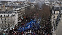 Protesters march during a rally on a second day of nationwide strikes and protests over the government's proposed pension reform, in Paris on January 31, 2023. - France braces for major transport blockages, with mass strikes and protests set to hit the country for the second time in a month in objection to the planned boost of the age of retirement from 62 to 64. On January 19, some 1.1 million voiced their opposition to the proposed shake-up -- the largest protests since the last major round of pension reform in 2010. (Photo by JULIEN DE ROSA / AFP) (Photo by JULIEN DE ROSA/AFP via Getty Images)