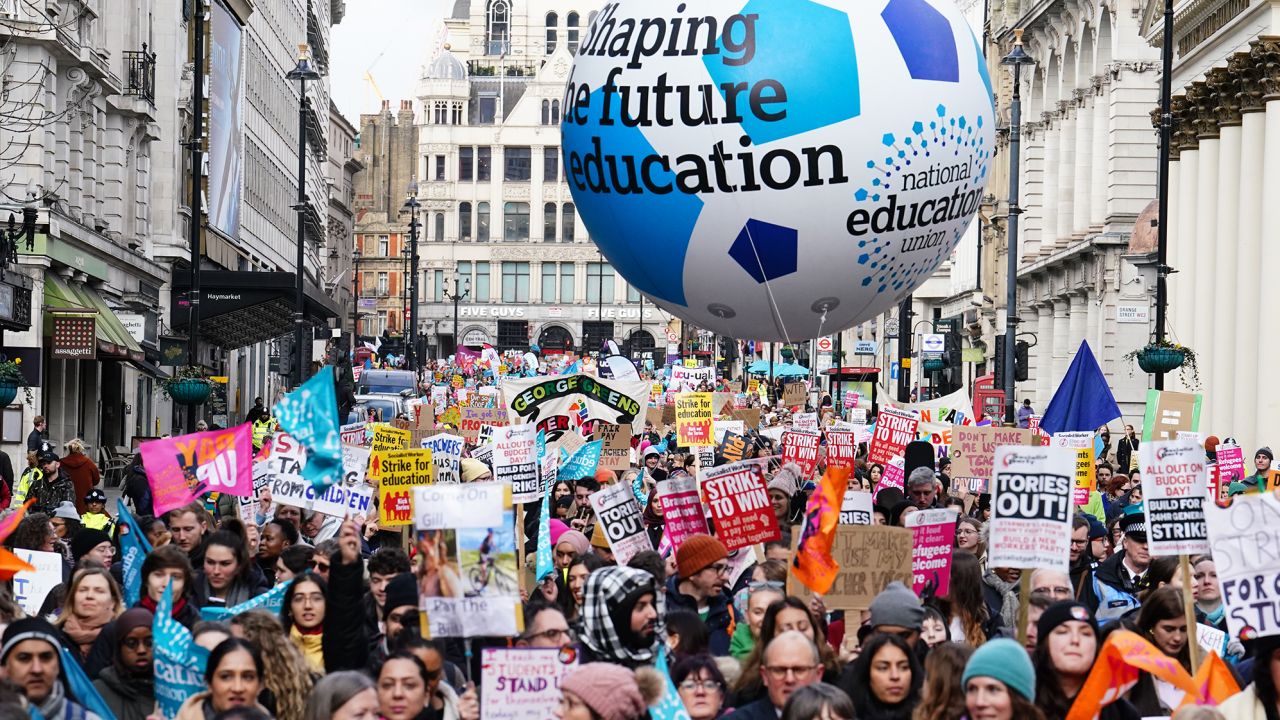 Members of the National Education Union protest over pay and working conditions during a march to the seat of parliament in Westminster, London on February 1, 2023.