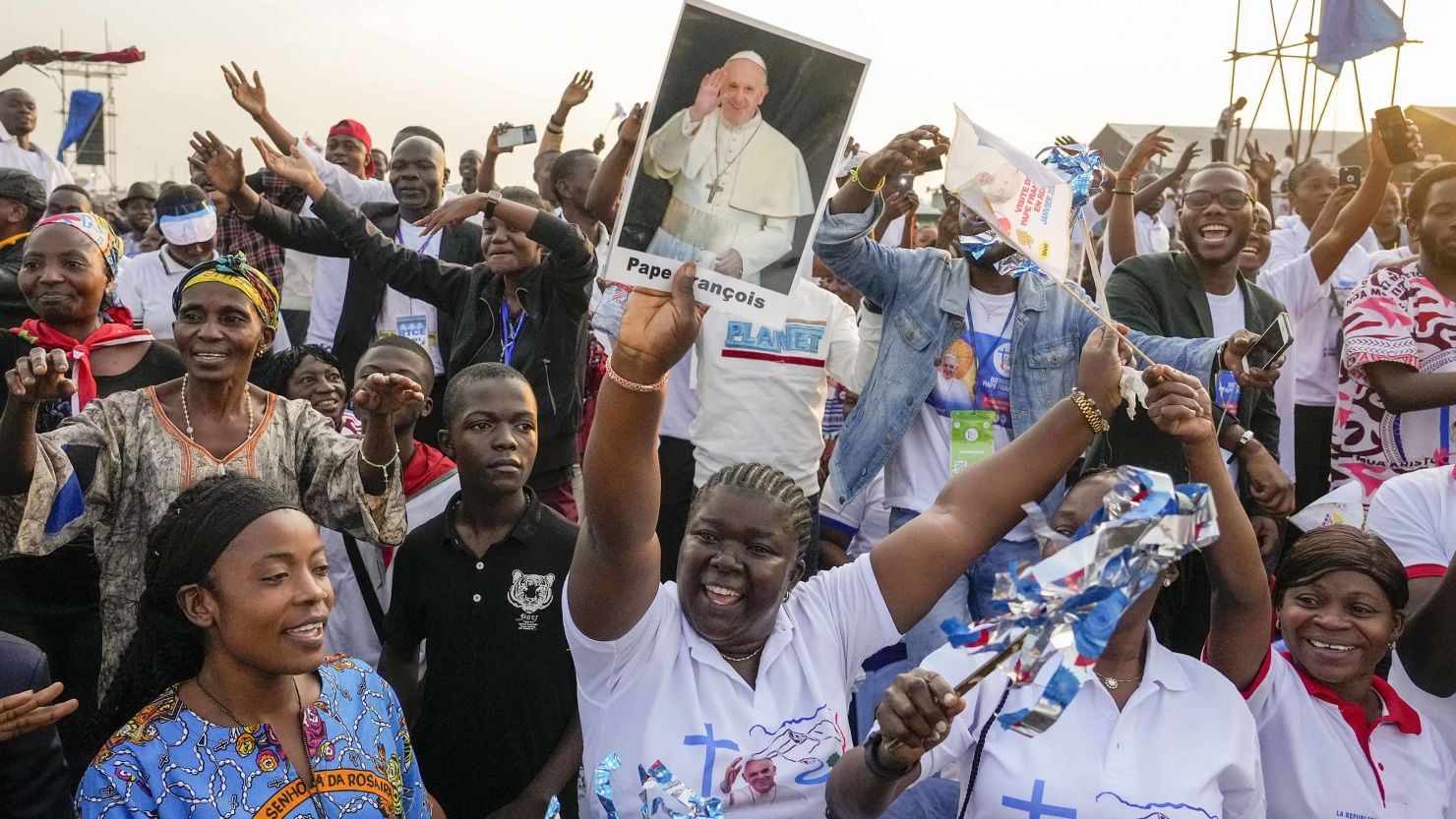 People wait for the arrival of Pope Francis at N'Dolo Airport in Kinshasa in the Democratic Republic of the Congo on Wednesday.